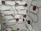 a wine rack that has a bunch of wine glasses on it