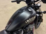 a close up of a motorcycle parked in a parking lot