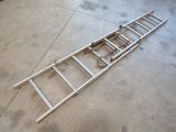 a ladder laying on the floor in a garage