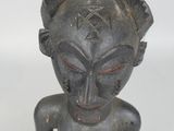 an image of a statue of a woman with a large head