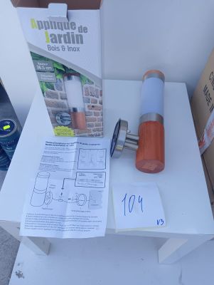a small table with a lamp and a box on it