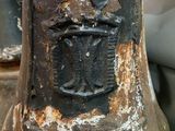 a close up of a rusted metal object on a table