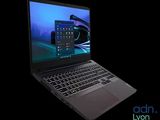 the laptop is open on a black background with a blue screen