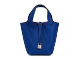 a blue handbag on a white background