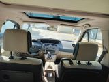a view of the inside of a car from the driver ' s seat