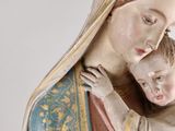a statue of a woman holding a child in her arms