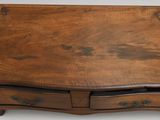 an old wooden table with two drawers and a drawer underneath it