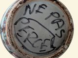 a picture of a close up of a vase with writing on it