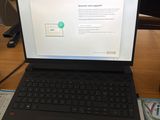 a laptop computer sitting on a desk next to a monitor