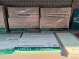 boxes of medical supplies are on a shelf in a store