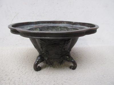 a black bowl that is sitting on top of a table