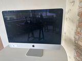 a computer monitor sitting on top of a white desk