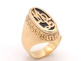 an image of a gold signet ring with a black and white design