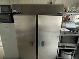 an image of a kitchen with a refrigerator and a sink