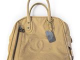 a chanel handbag with a tag on it