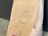 a cardboard box that has a picture of a skateboard on it