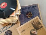 a lot of records on a table with a record on top