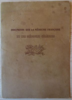 an old book sitting on top of a wooden table