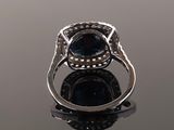 a close up of a ring on a reflective surface with a reflection