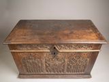 an old wooden chest with carvings and carvings on it