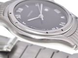 a close up of a wrist watch on a metal bracelet