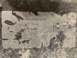 a sign on the side of a building that says whittory plate
