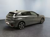 the rear end of a silver car in a room