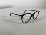 a close up of a pair of glasses on a white surface