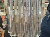 a glass chandelier hanging from the ceiling in a room