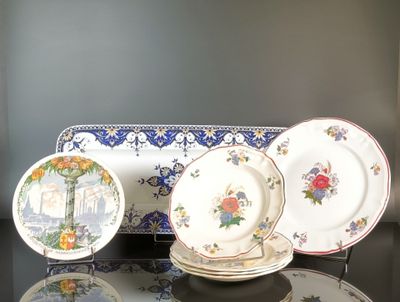three plates and a tray sitting on a table