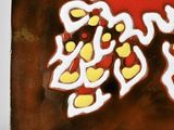 a picture of a red and yellow tile with a bird on it