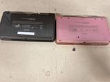 two laptops that are sitting side by side on the floor