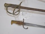 two swords that are on display on a table