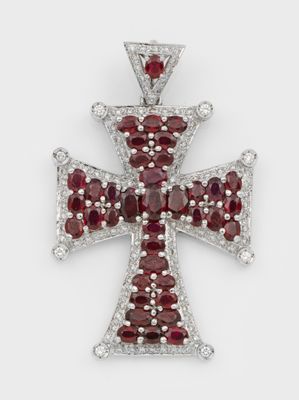a ruby and diamond cross pendant