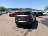 many cars parked in a parking lot in a parking lot