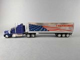 a toy semi truck with an american flag on the side