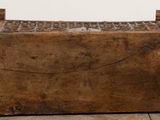 an old wooden box sitting on top of a wooden floor