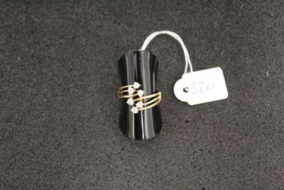 a ring that is sitting on top of a black object