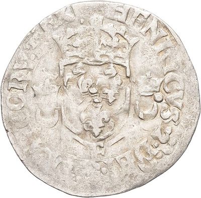 a close up of a coin with a crown on it