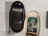 a cell phone that is sitting next to a remote control