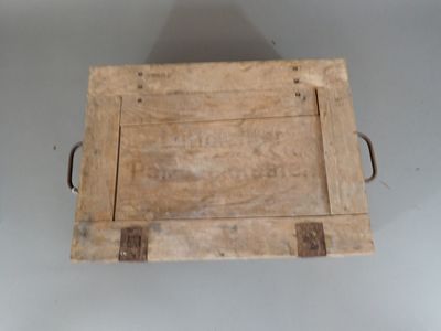 a wooden tray with a handle on a table