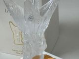 a bottle of perfume that is wrapped in plastic