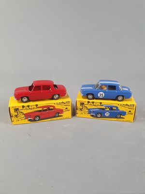 three toy cars are sitting on top of each other on a white surface