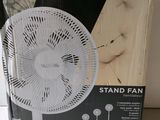 a close up of a box of a white fan on a table