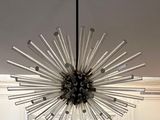 a large chandelier hanging from the ceiling in the kitchen