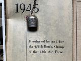 an old book with a bell hanging from it ' s cover