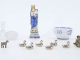 a lot of figurines that are sitting on a table
