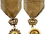 two medals with a medallion and a medal on a white background