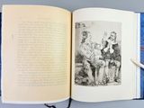 a open book with a drawing of a man and a woman sitting on a bench