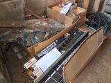 a pile of electronic equipment in a box in a room